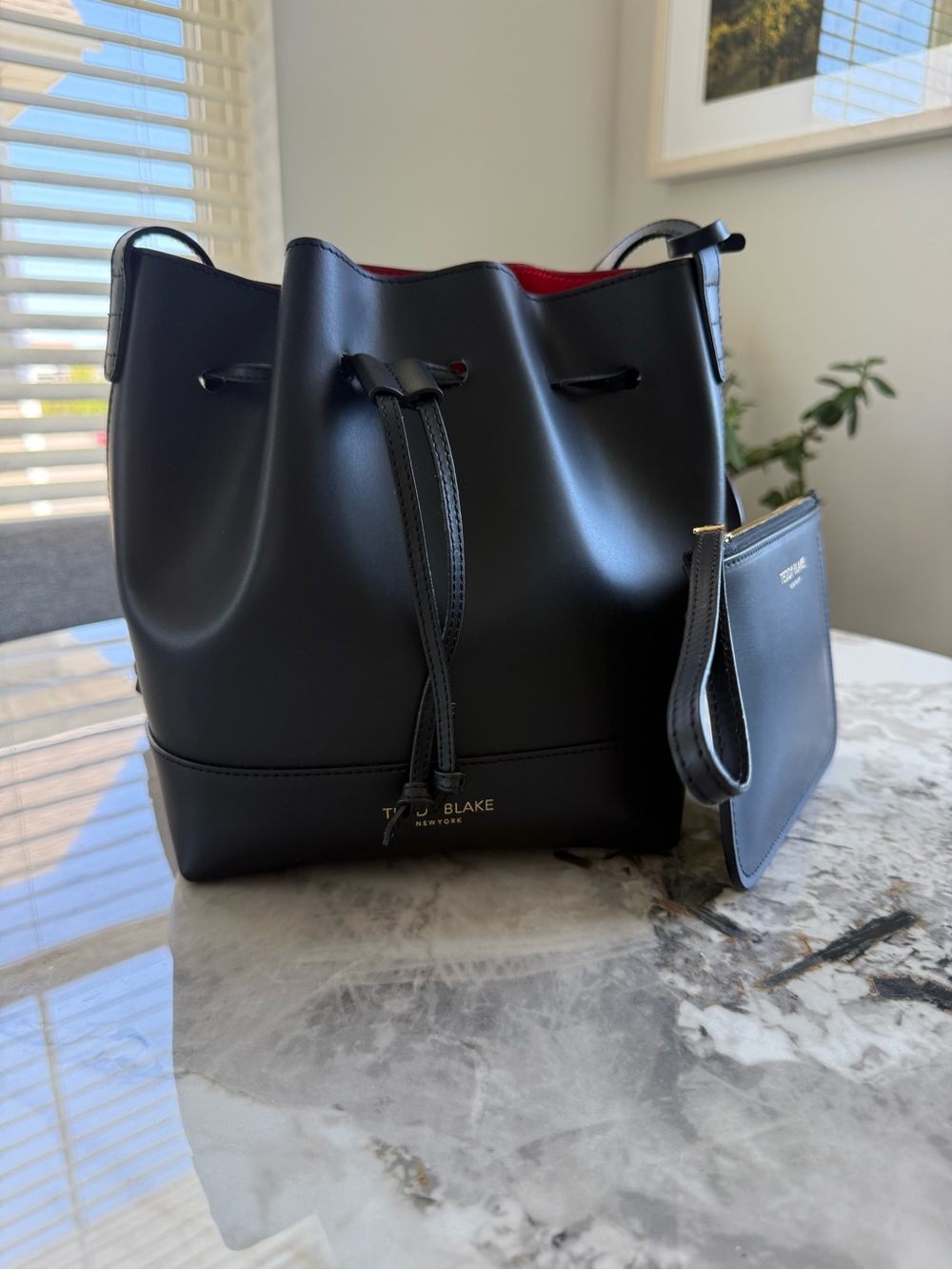 Teddy Blake Black Leather Drawstring Bucket Bag with stunning Red interior. 🖤❤️